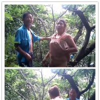 民工大叔在树林里吃快餐